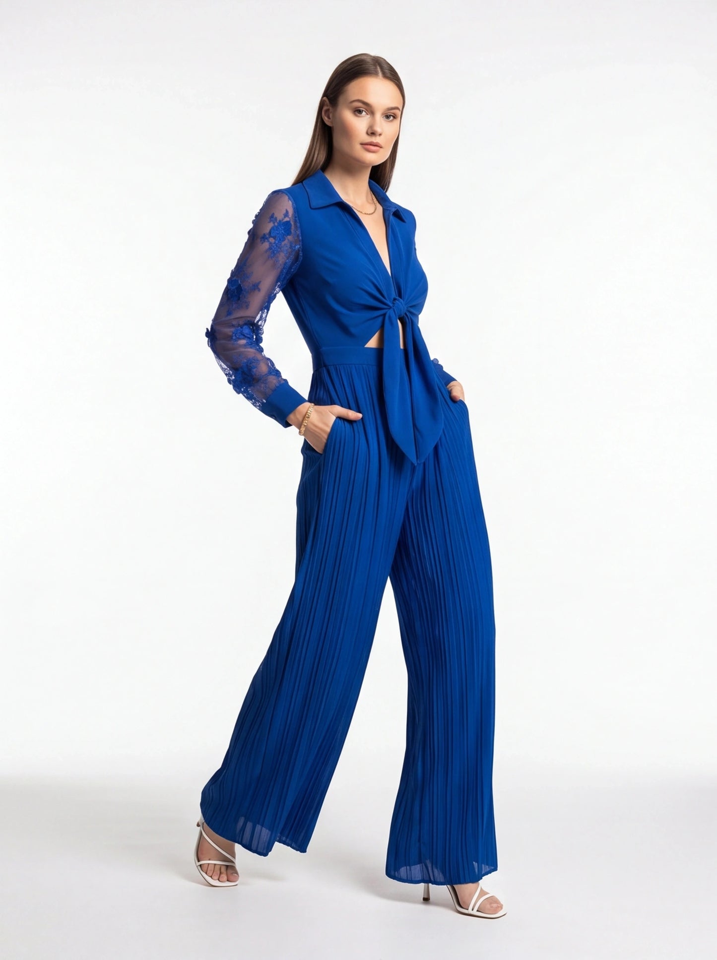 Jamota blue jumpsuit with sheer lace sleeves, knot-front waist and wide pleated legs
