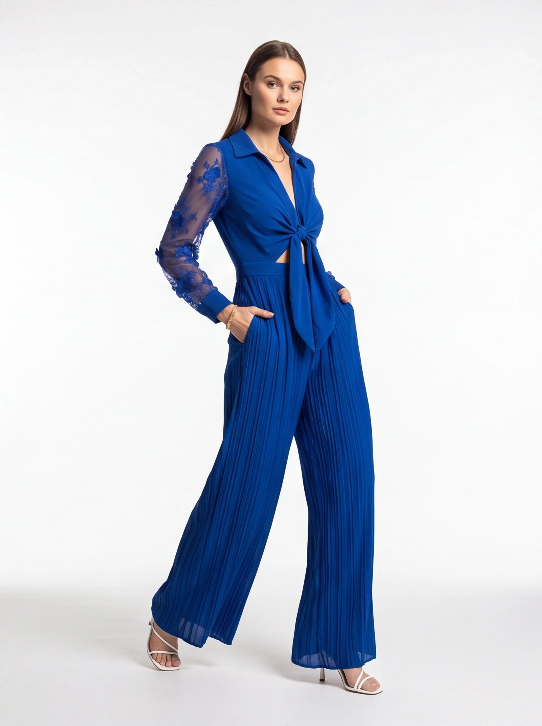 Jamota blue jumpsuit with sheer lace sleeves, knot-front waist and wide pleated legs