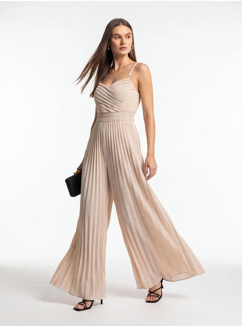 Jamota beige jumpsuit with pleated bodice, adjustable straps and wide-leg pants.