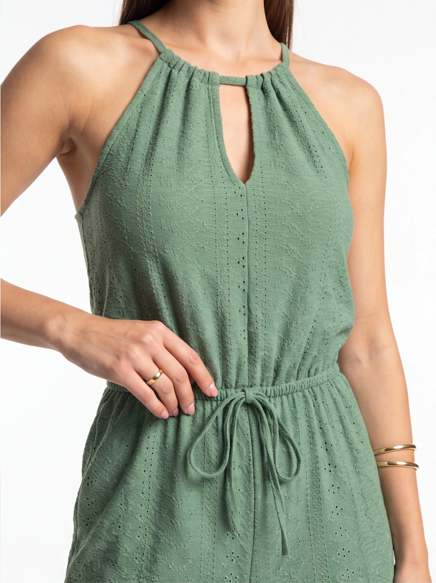 Jamota sage green jumpsuit with halter neckline, keyhole front and tied waist in textured eyelet fabric