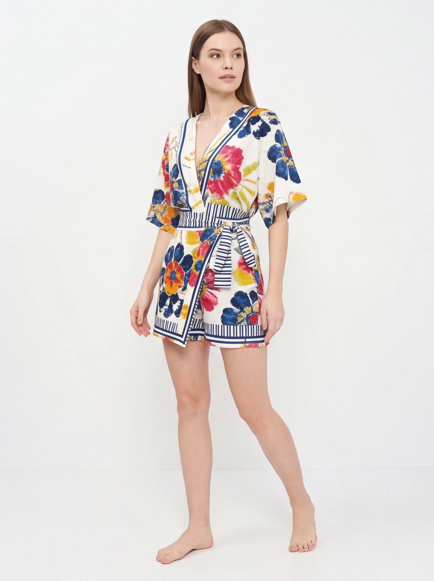 Jamota white floral print romper with adjustable straps, pockets and striped waist belt