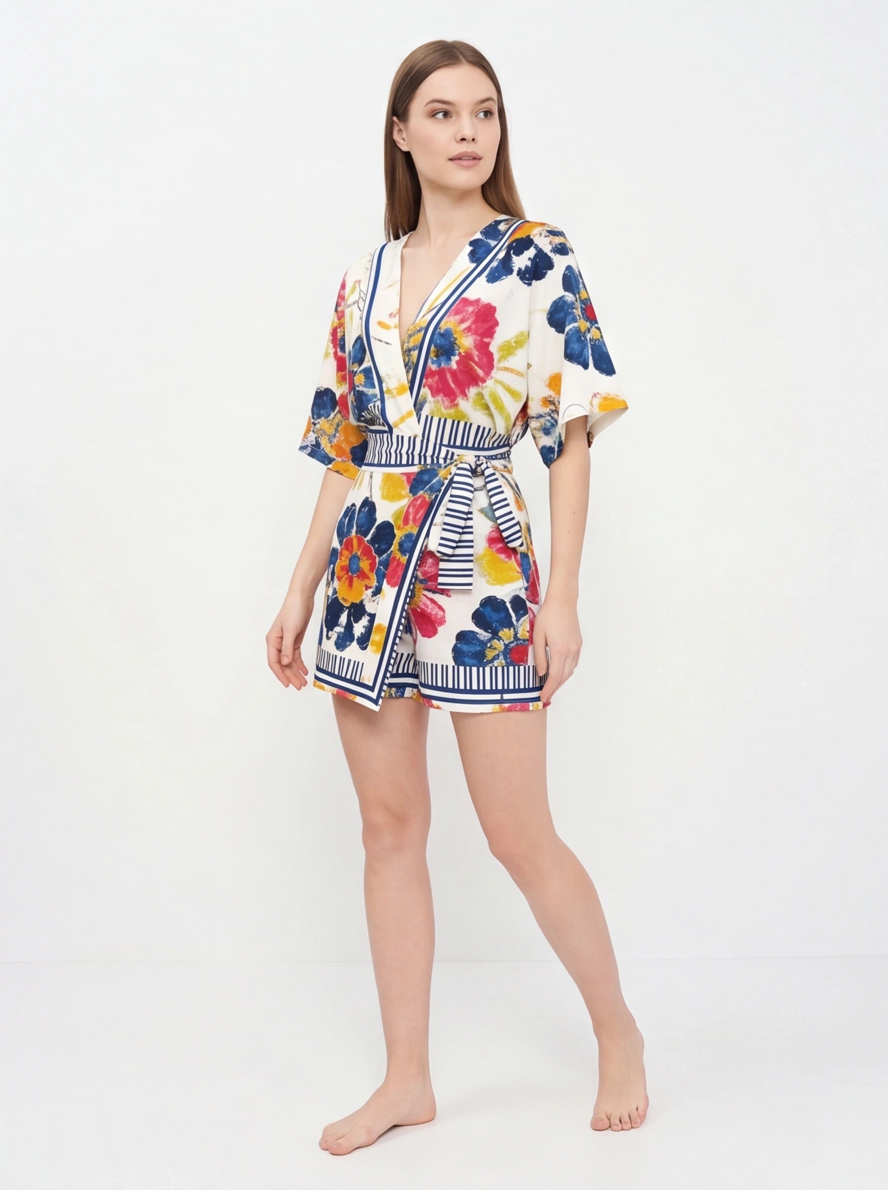 Jamota white floral print romper with adjustable straps, pockets and striped waist belt