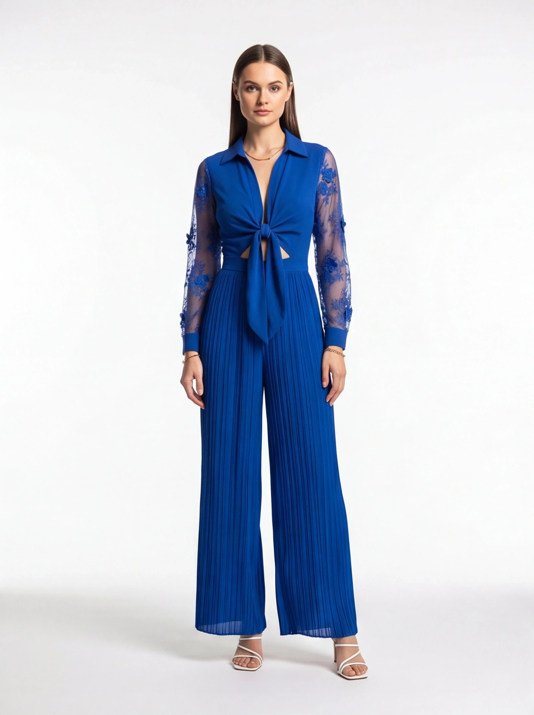 Jamota cobalt blue jumpsuit with sheer lace sleeves, deep V neckline, knotted front and wide pleated legs
