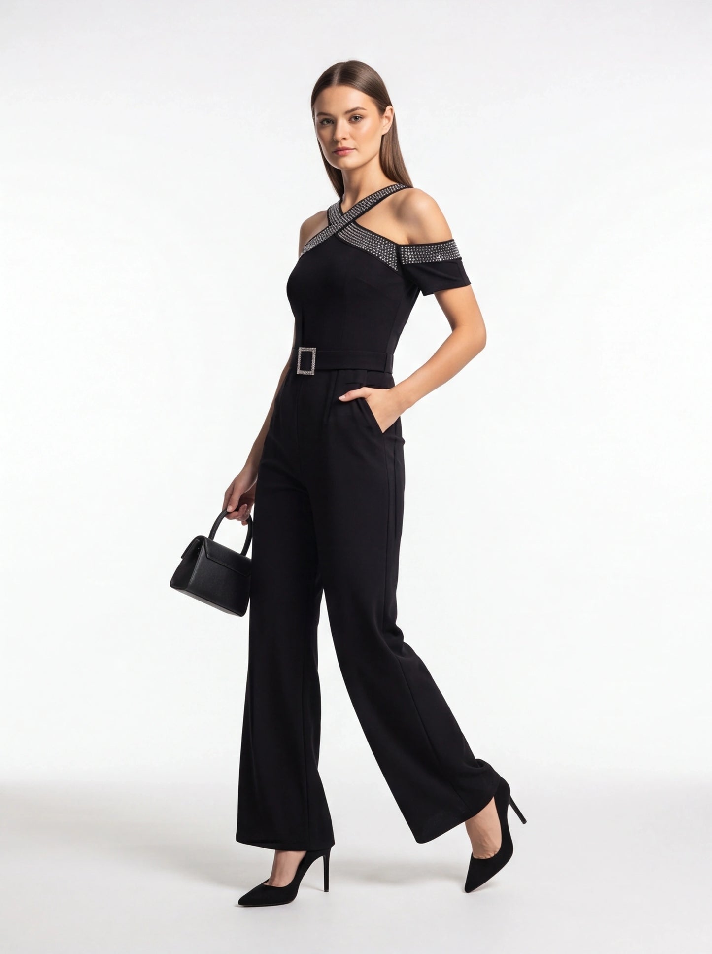 Jamota black women's jumpsuit with cold-shoulder neckline, criss-cross embellished straps, pockets and belt.