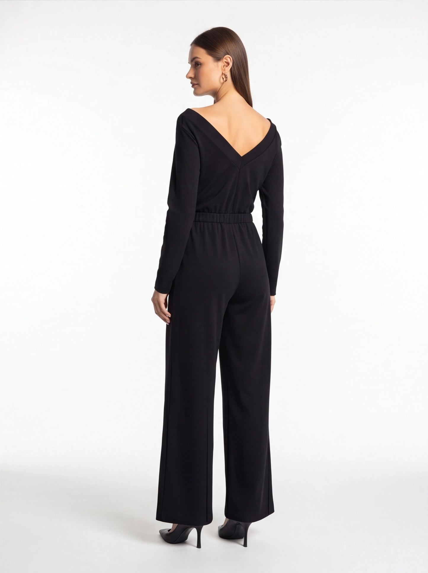 Jamota black jumpsuit with V-back neckline, long sleeves, elastic waist and wide-leg pants.