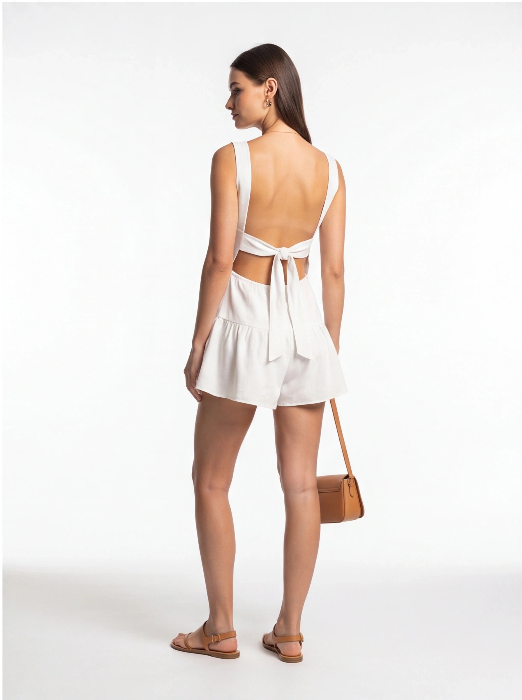 Jamota white backless jumpsuit with wide straps and a back bow, one-piece