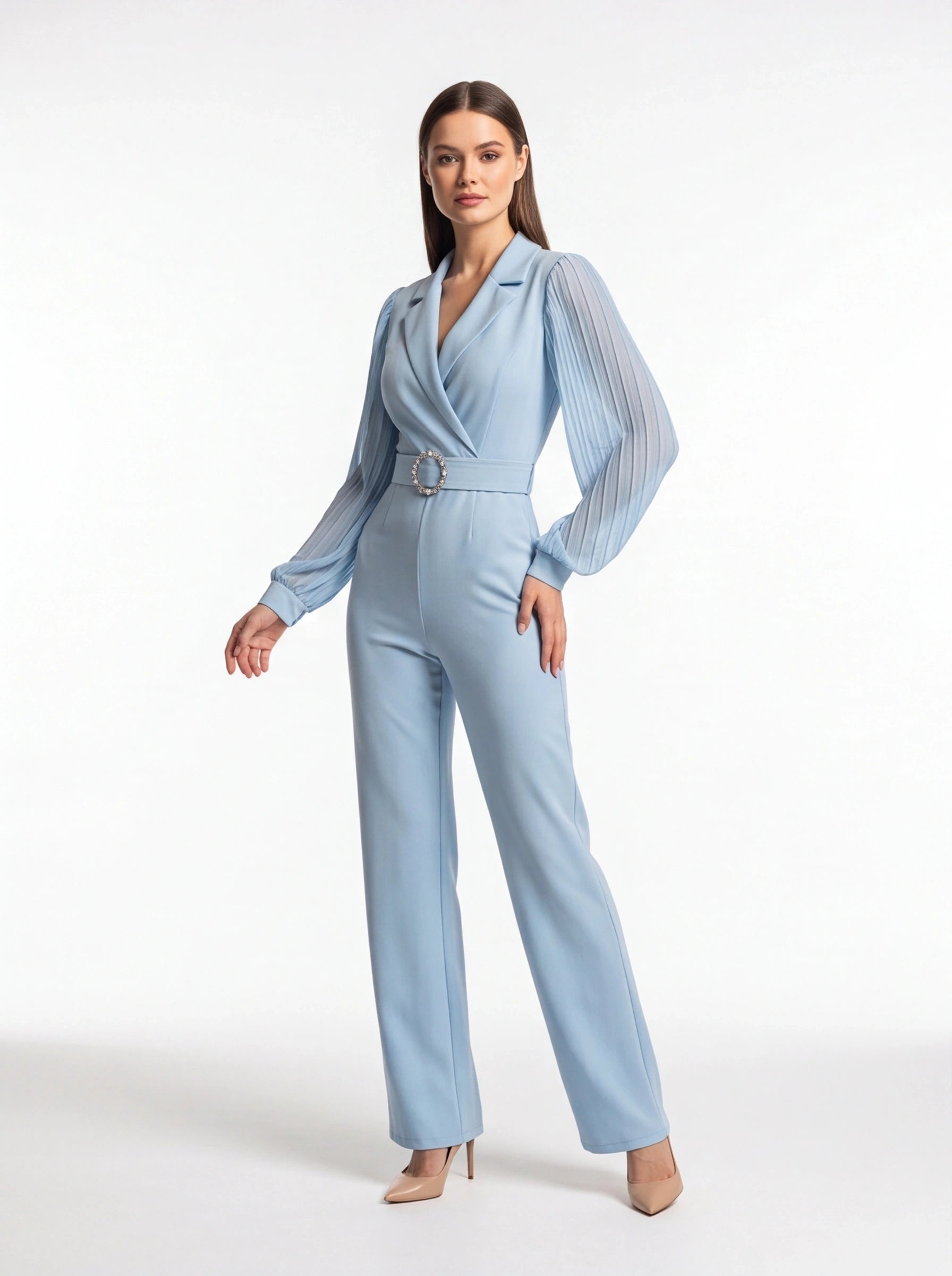Jamota light blue jumpsuit with pleated sheer long sleeves, structured lapels, and jeweled circular belt buckle.