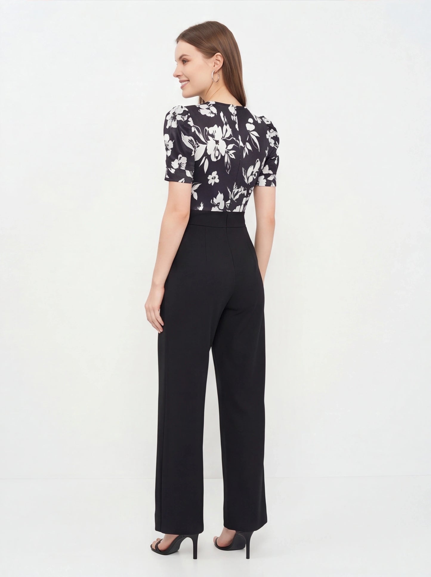Jamota black floral print jumpsuit with short puff sleeves and wide-leg pants, one-piece silhouette