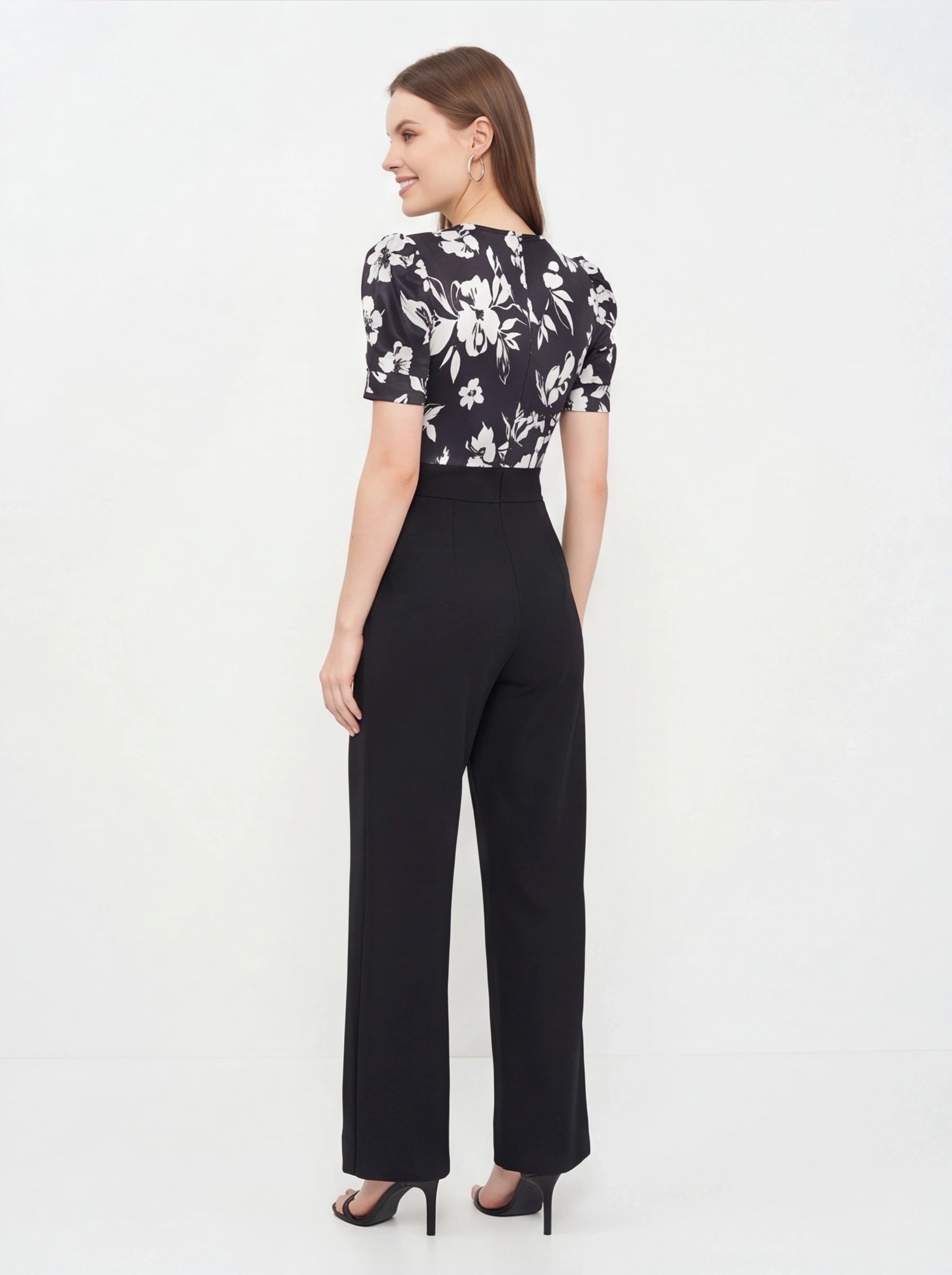 Jamota black floral print jumpsuit with short puff sleeves and wide-leg pants, one-piece silhouette