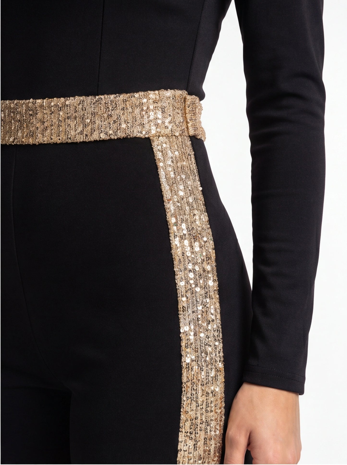 Jamota black jumpsuit with gold sequin belt around waist