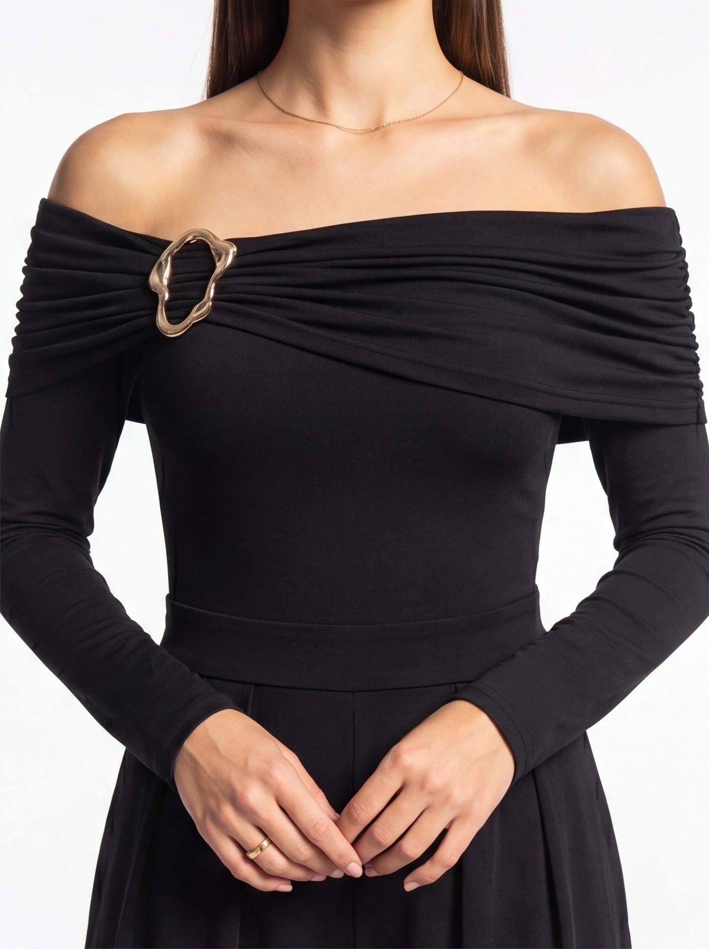 Jamota black jumpsuit off-shoulder neckline with ruched drape and gold buckle belt detail