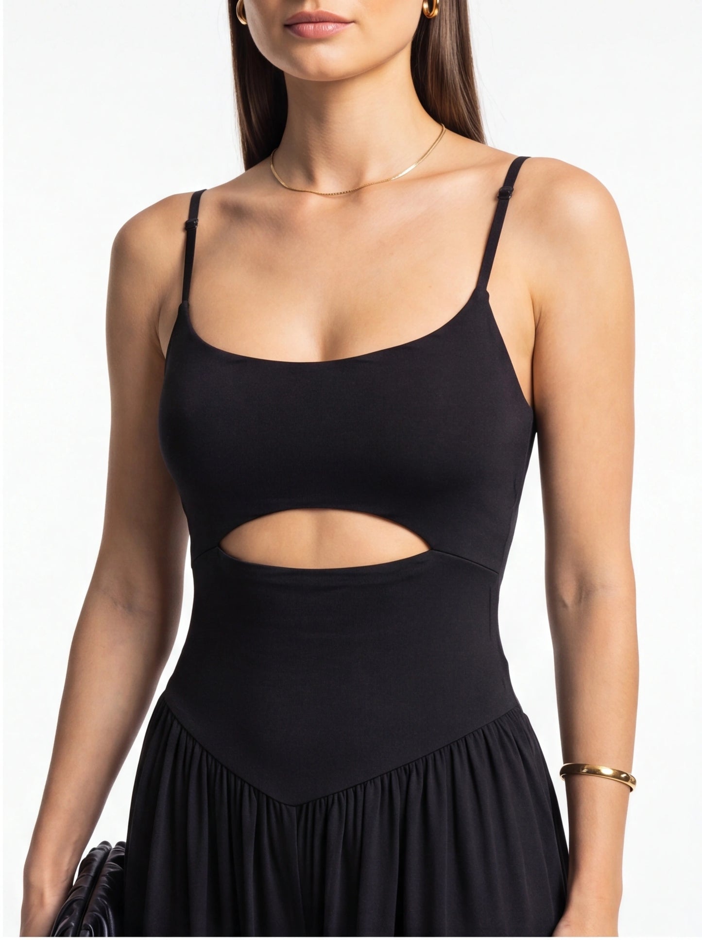 Jamota black jumpsuit with adjustable thin straps and a pleated, skirt-like lower section