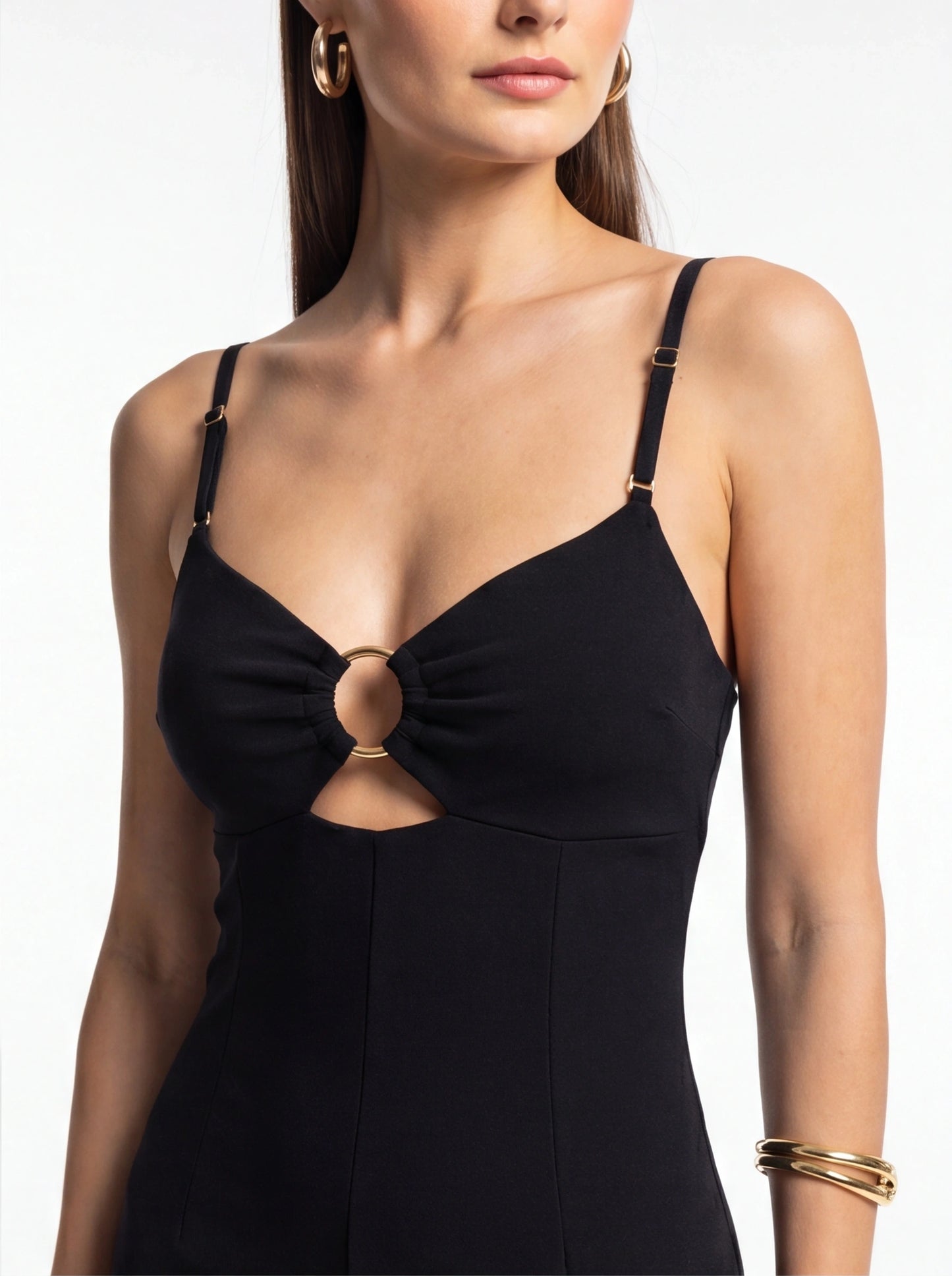 Jamota black jumpsuit with adjustable straps and front center ring knot detail with gold hardware