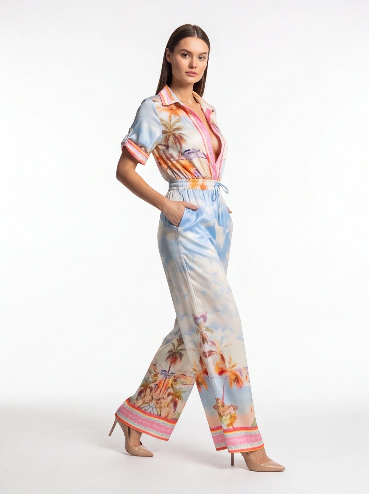 Jamota light blue tropical print jumpsuit with pockets, tie waist belt and short rolled sleeves