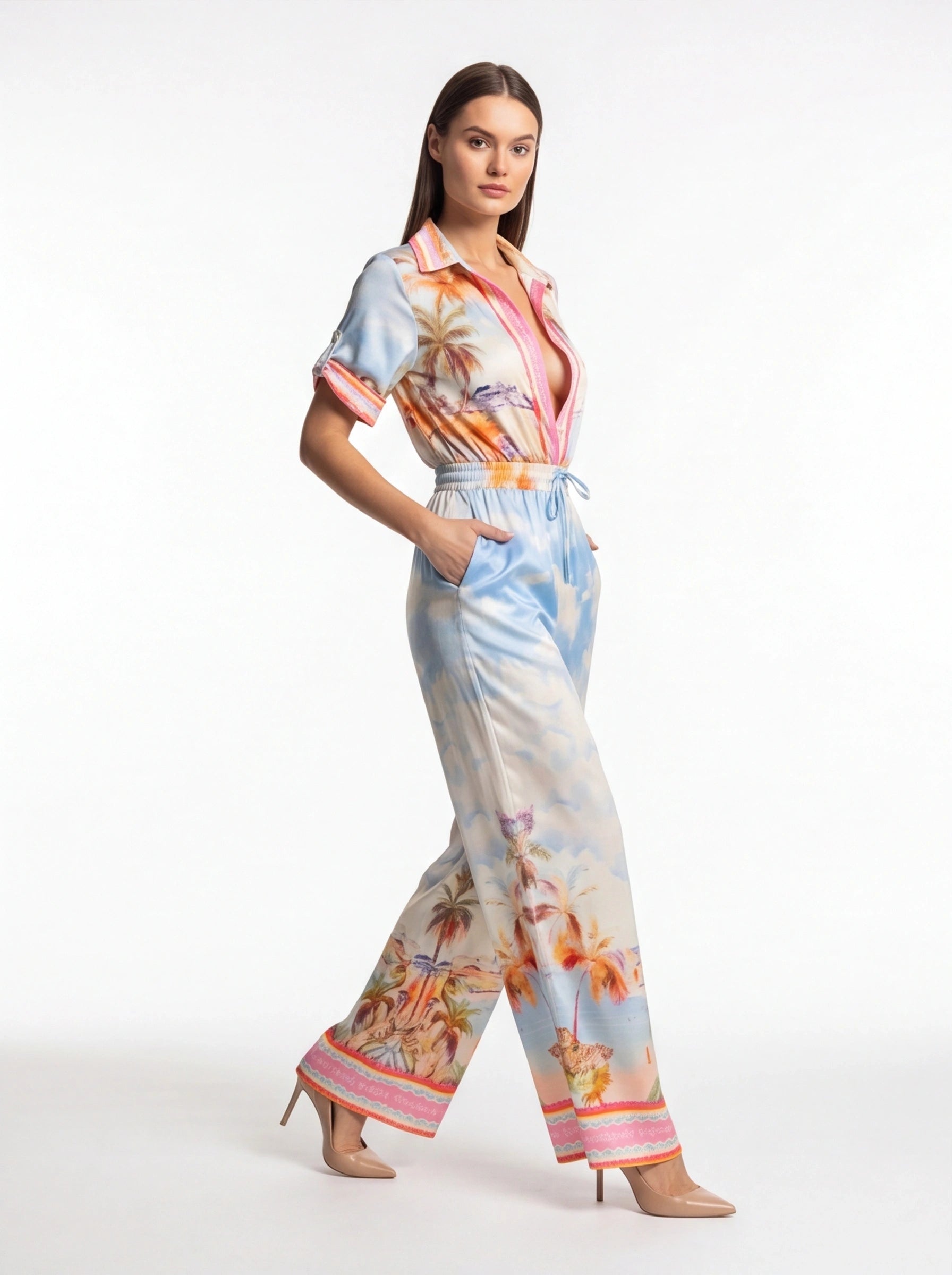 Jamota light blue tropical print jumpsuit with pockets, tie waist belt and short rolled sleeves