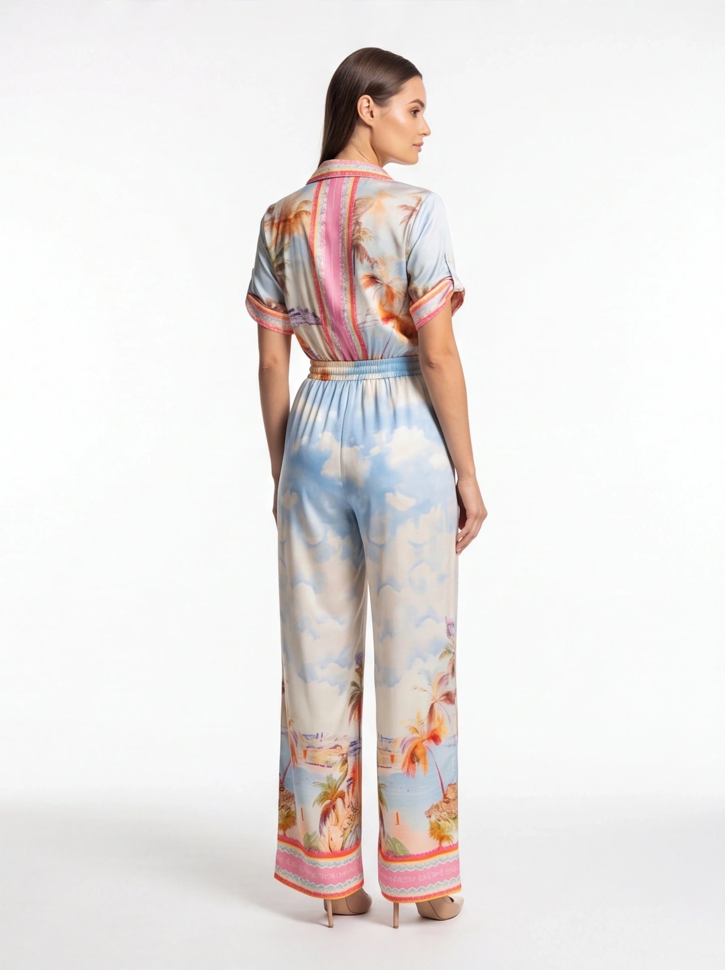 Jamota blue tropical print jumpsuit with short sleeves, elastic waist and pink back stripe detail