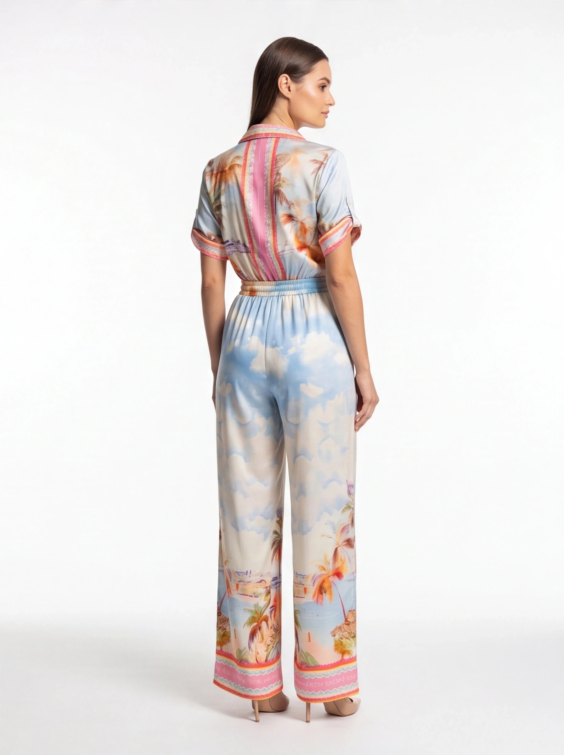 Jamota blue tropical print jumpsuit with short sleeves, elastic waist and pink back stripe detail
