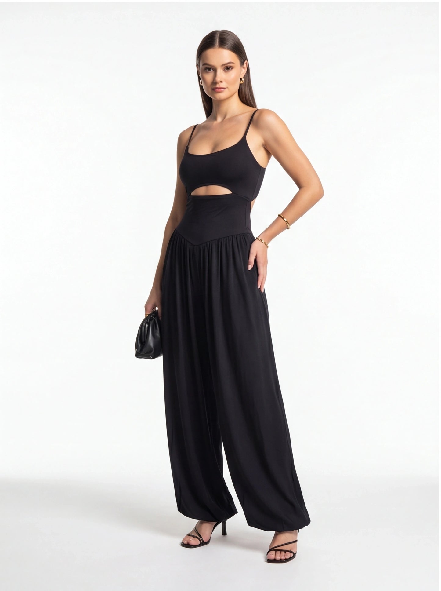 Jamota black backless jumpsuit with adjustable spaghetti straps and wide-leg pants.