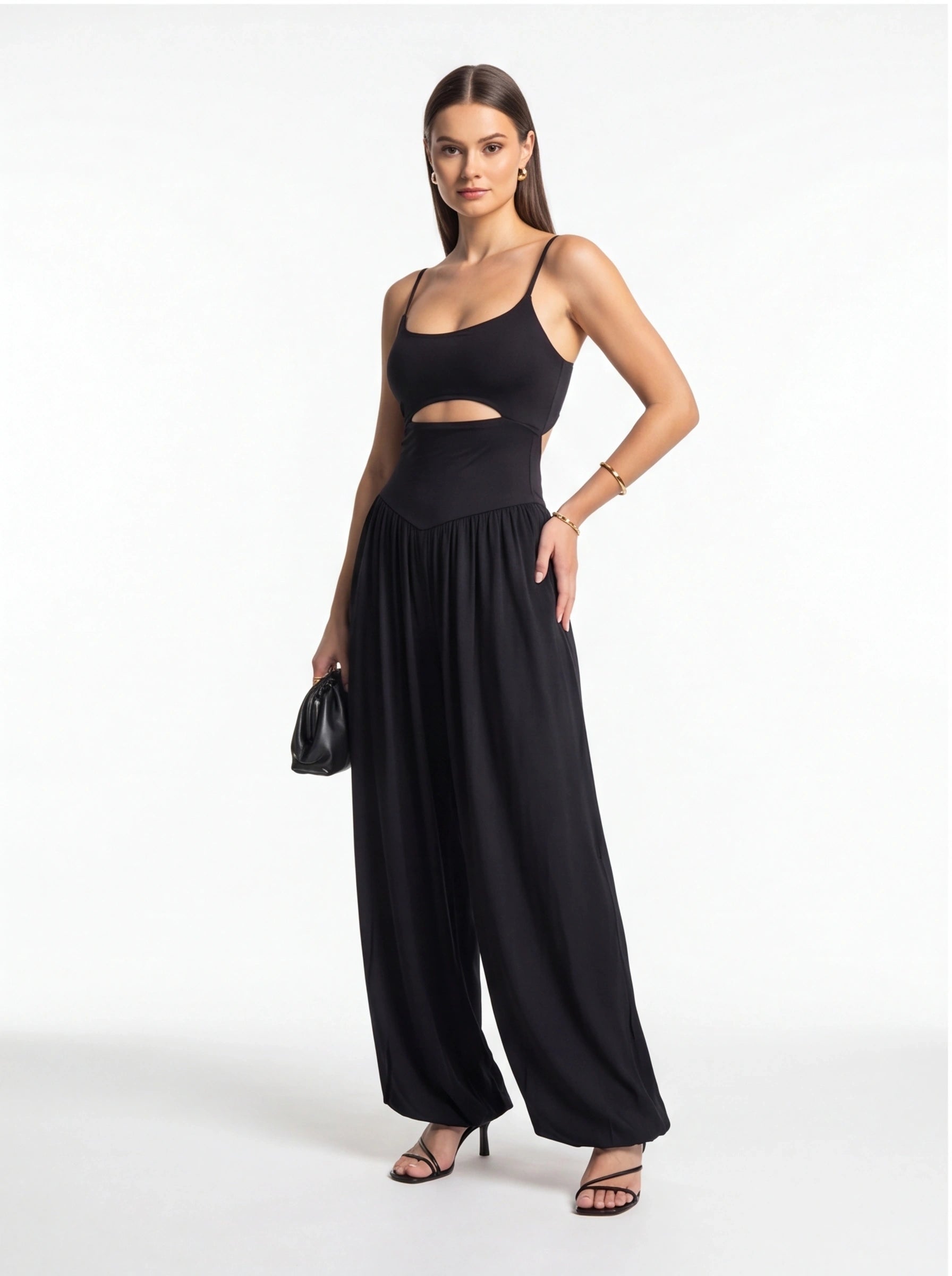 Jamota black backless jumpsuit with adjustable spaghetti straps and wide-leg pants.