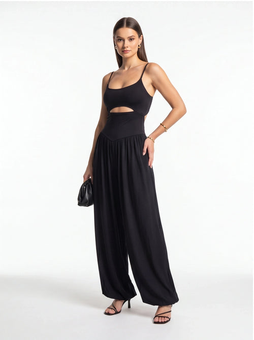 Jamota black backless jumpsuit with adjustable spaghetti straps and wide-leg pants.