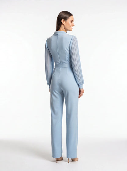 Jamota light-blue jumpsuit with tailored fit, pleated sheer long sleeves, waist belt and back zipper.