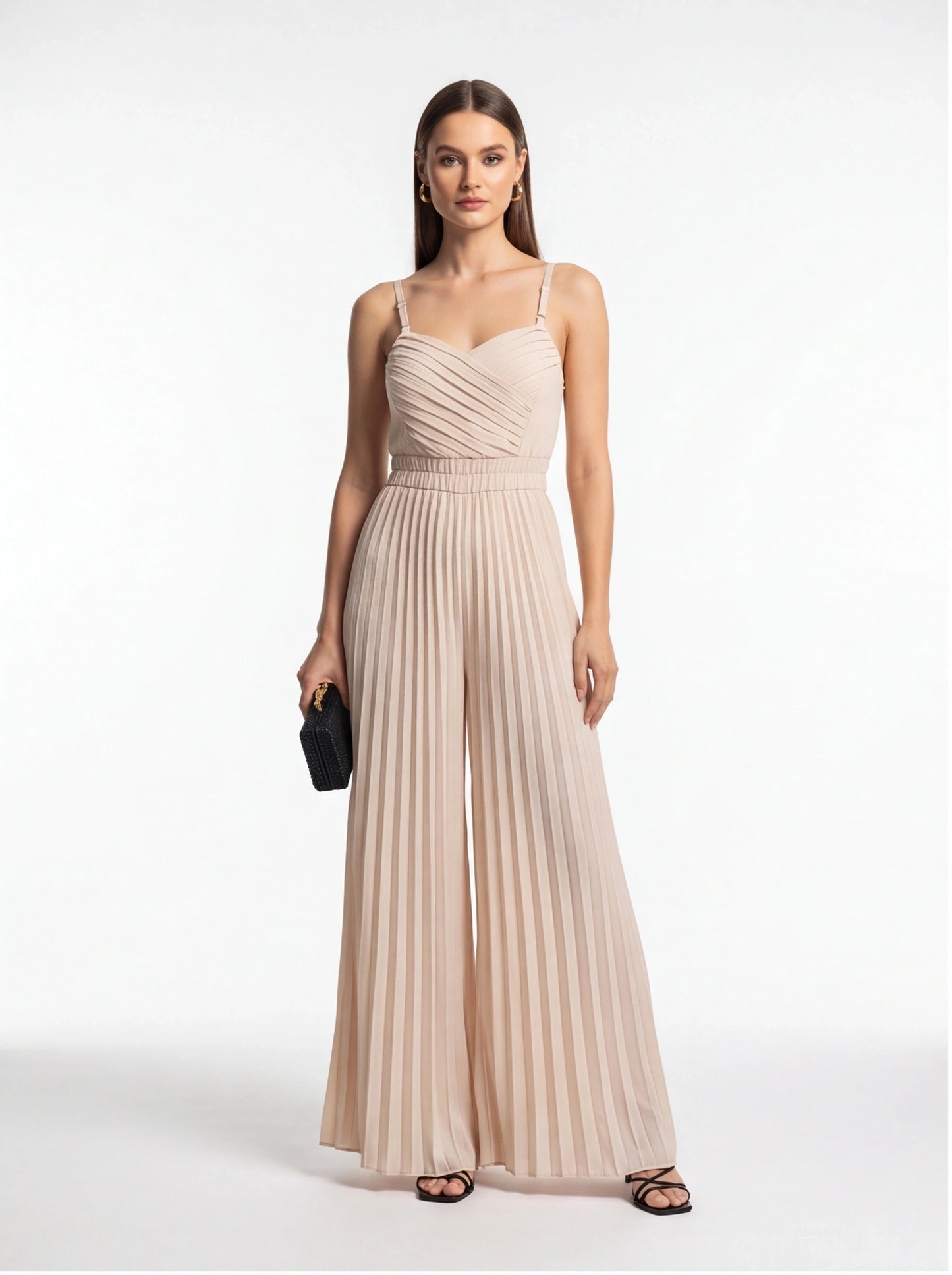 Jamota beige jumpsuit with adjustable straps and a pleated, ruched bodice that flows into wide-leg pants.