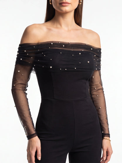 Jamota black off-shoulder jumpsuit with sheer pearl-embellished neckline and pearl-dotted mesh sleeves