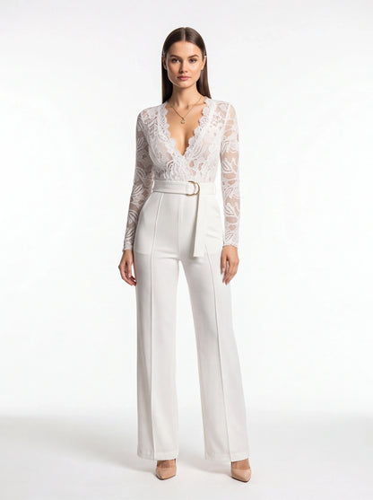 Jamota white floral lace jumpsuit with long sleeves, deep V-neckline, belt, and wide-leg pants