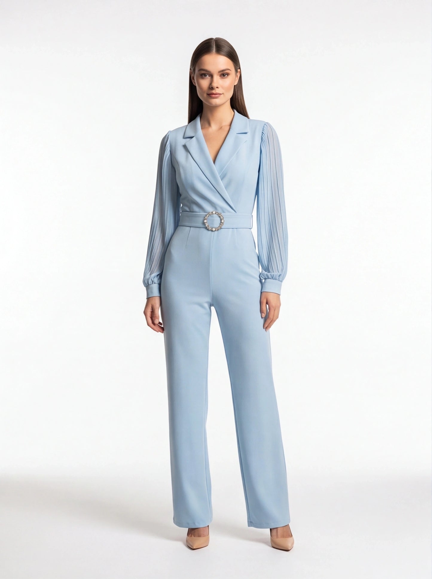 Jamota light blue jumpsuit with a belted waist featuring a circular rhinestone buckle and pleated long sleeves