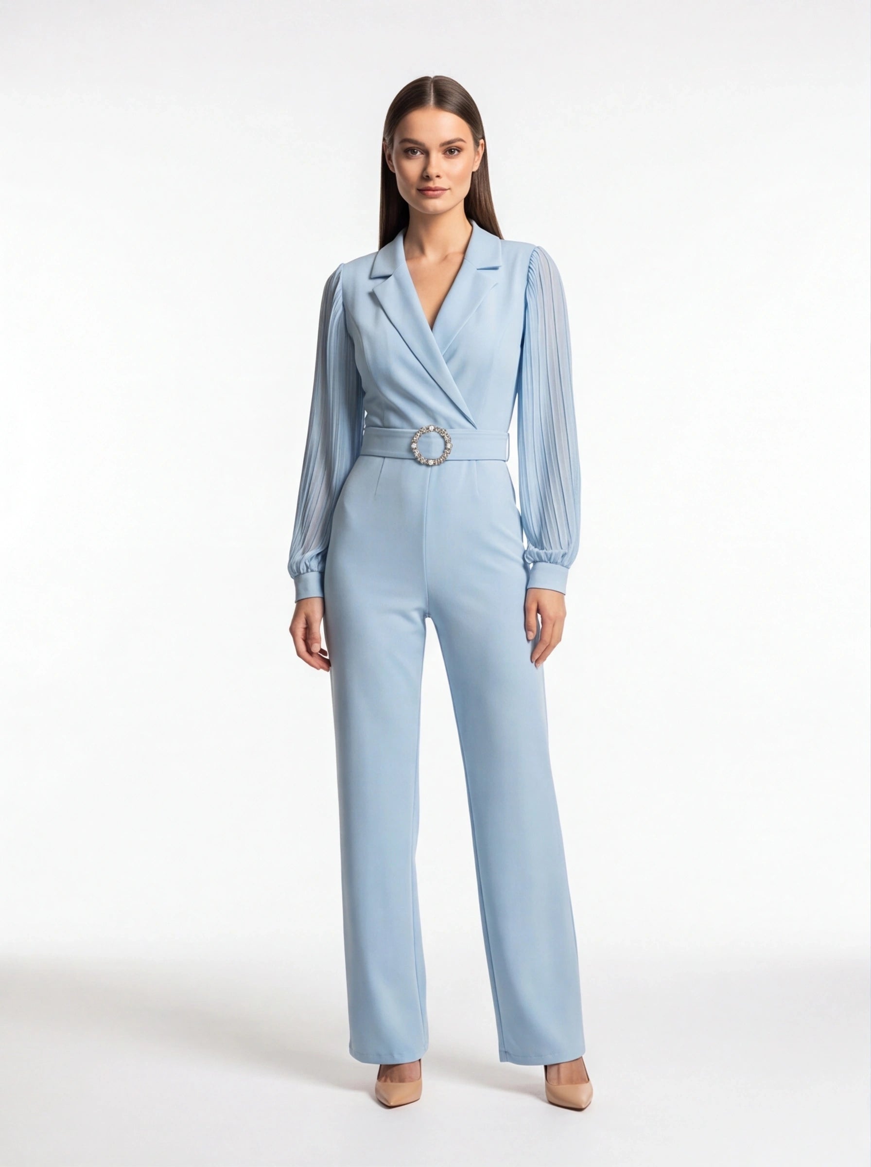 Jamota light blue jumpsuit with a belted waist featuring a circular rhinestone buckle and pleated long sleeves