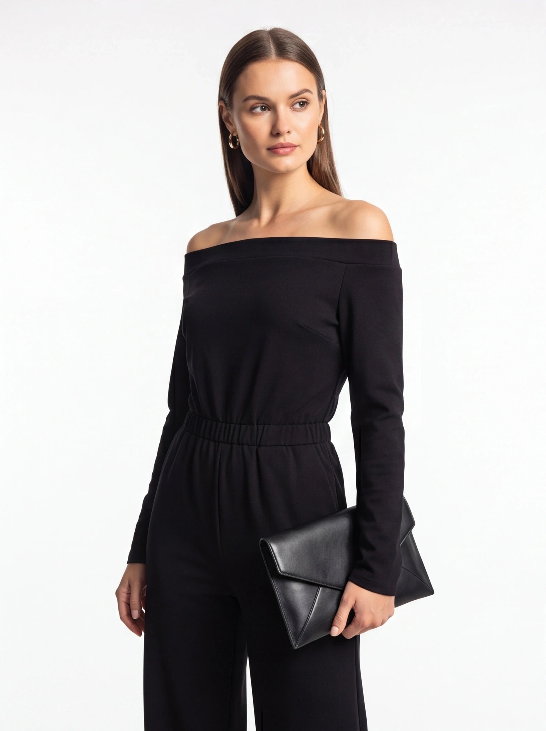 Jamota black jumpsuit with off-shoulder neckline, long sleeves and elastic waist.