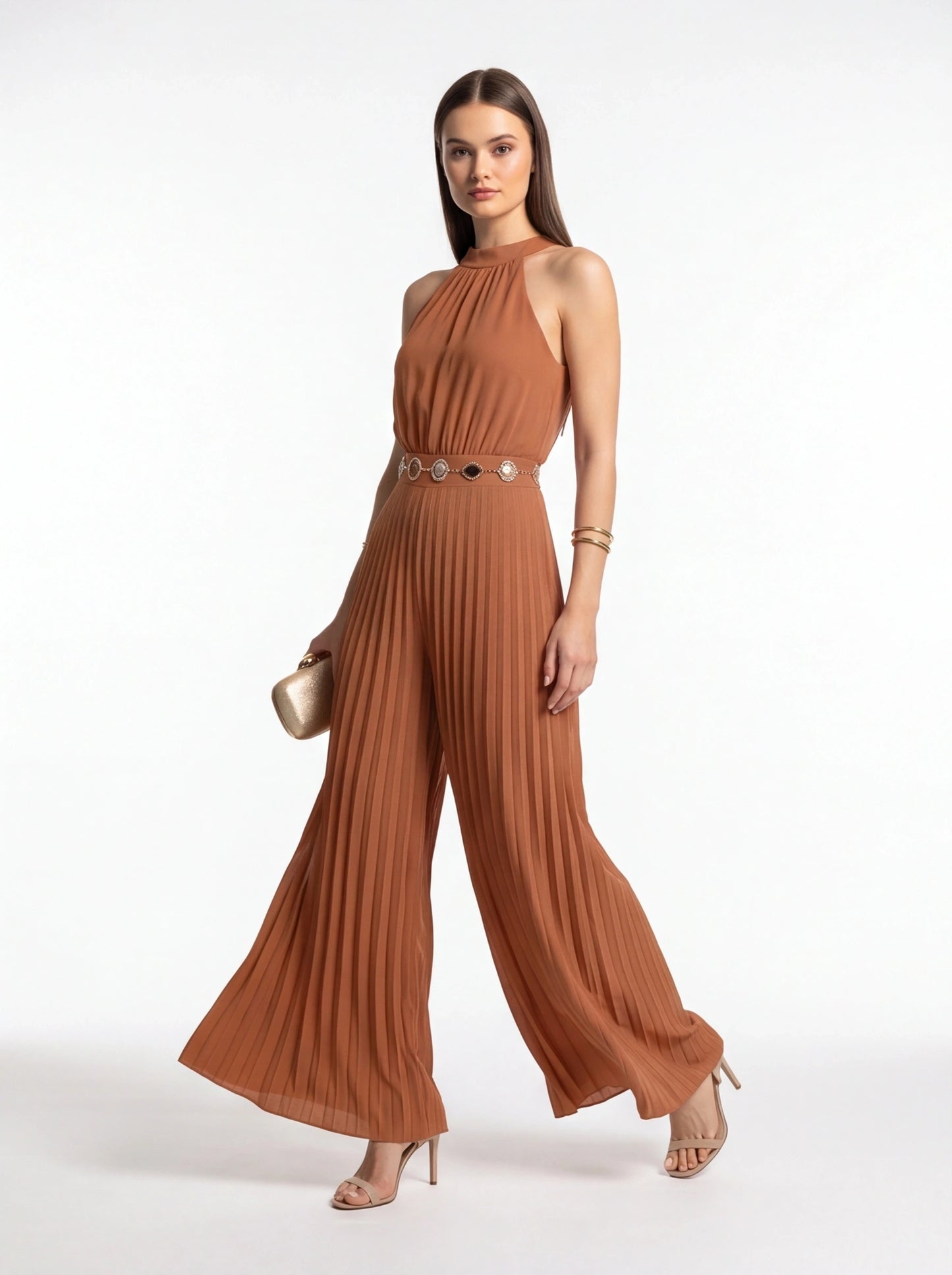 Jamota rust brown pleated wide-leg jumpsuit with halter neckline and decorative belt medallions