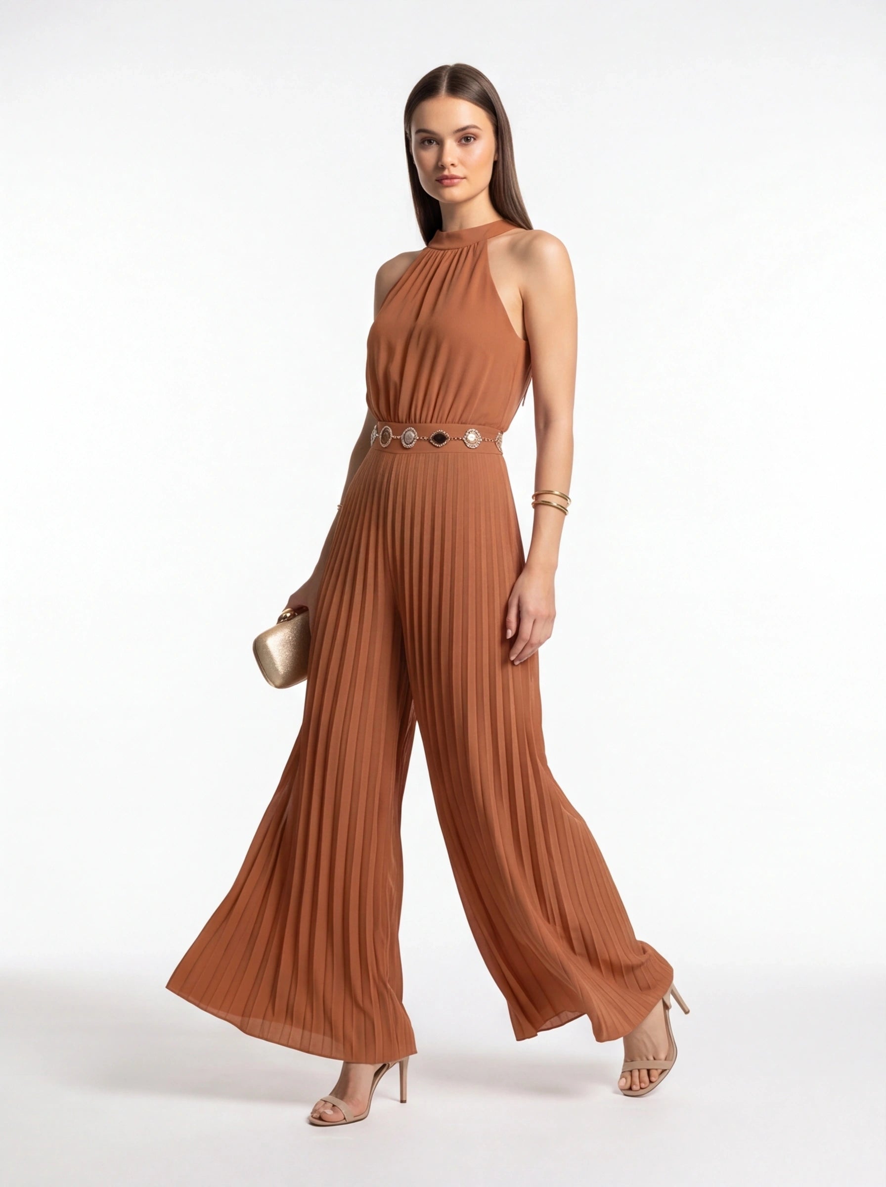 Jamota rust brown pleated wide-leg jumpsuit with halter neckline and decorative belt medallions