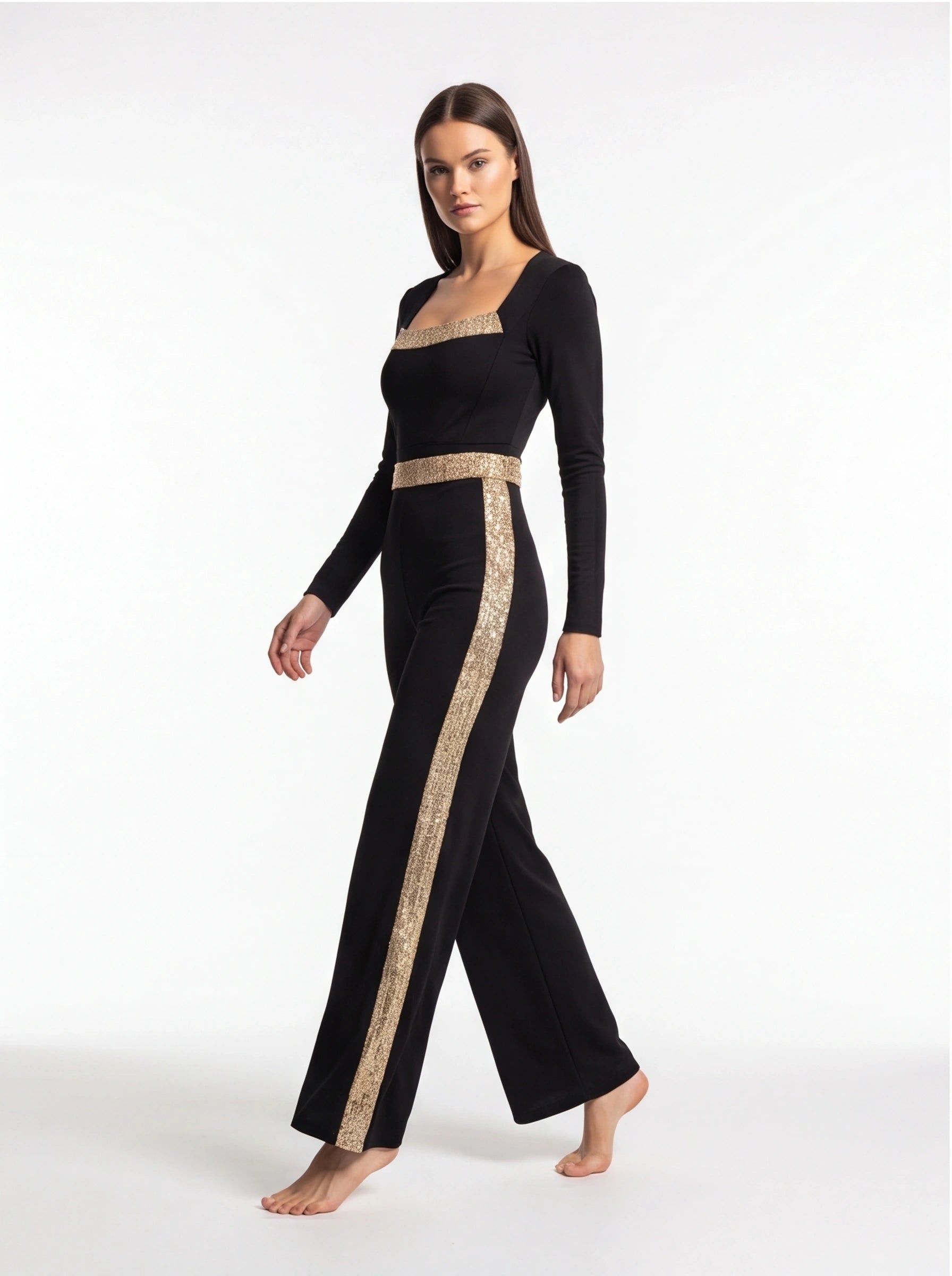 Jamota black jumpsuit with gold sequin stripes across the chest and down the sides, long sleeves, wide-leg pants.