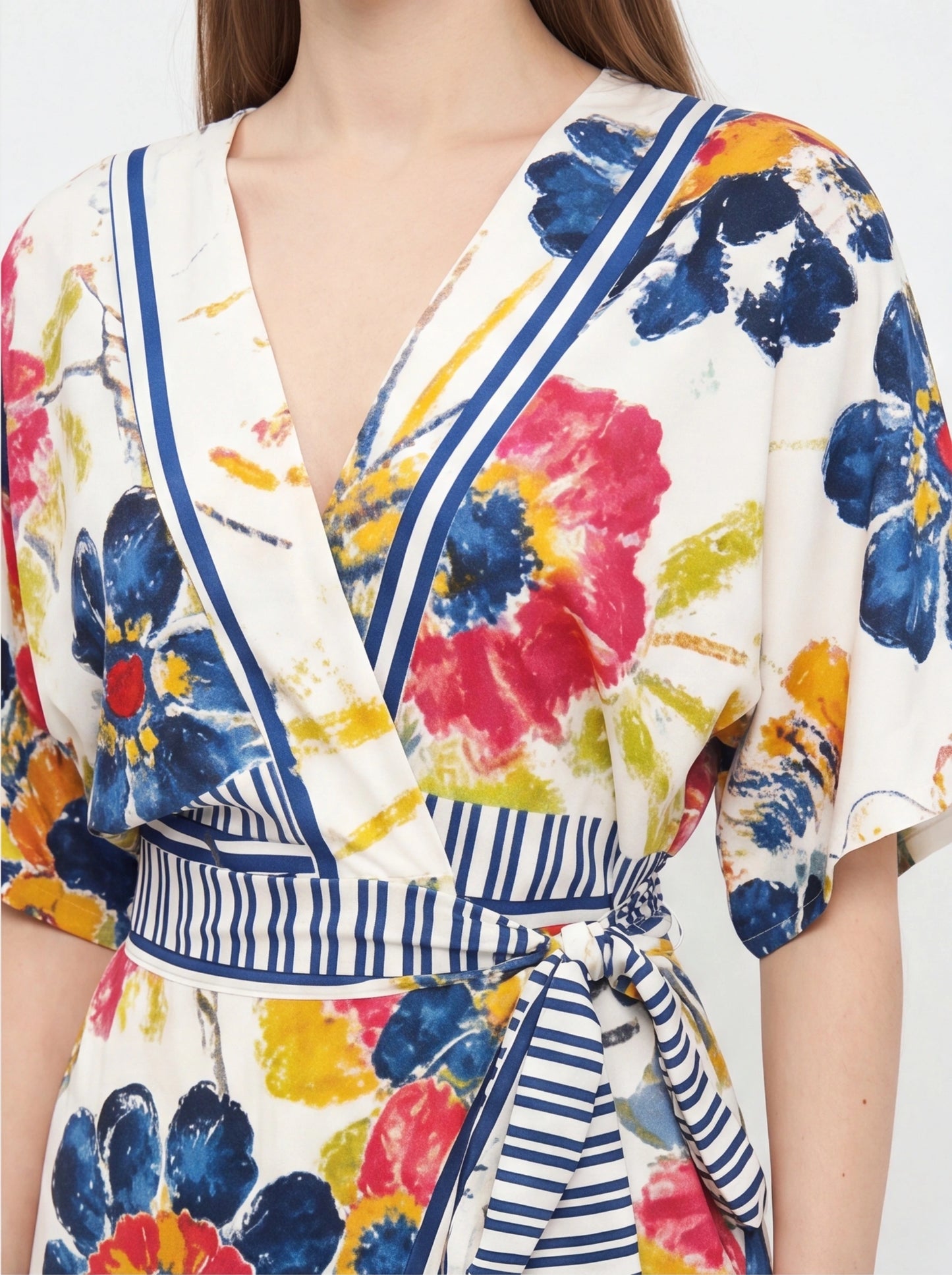 Rompers white wrap romper with multicolor watercolor floral print and blue striped trim along neckline and waist tie