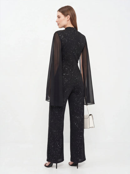 Jamota black glitter chiffon jumpsuit with sheer cape sleeves, back view, wide-leg pants