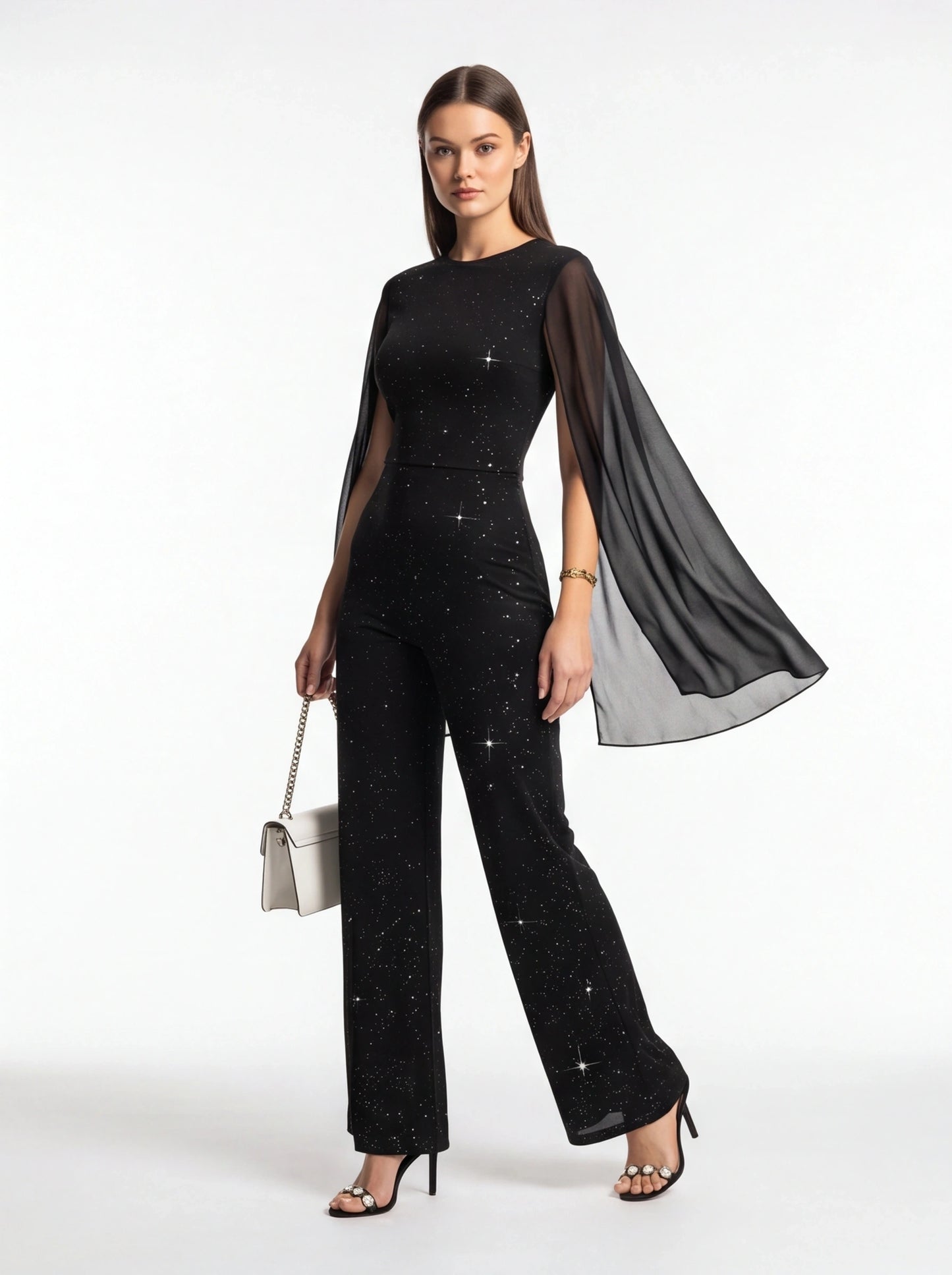 Jamota black jumpsuit with glitter speckled pattern and sheer cape sleeves, wide-leg pants