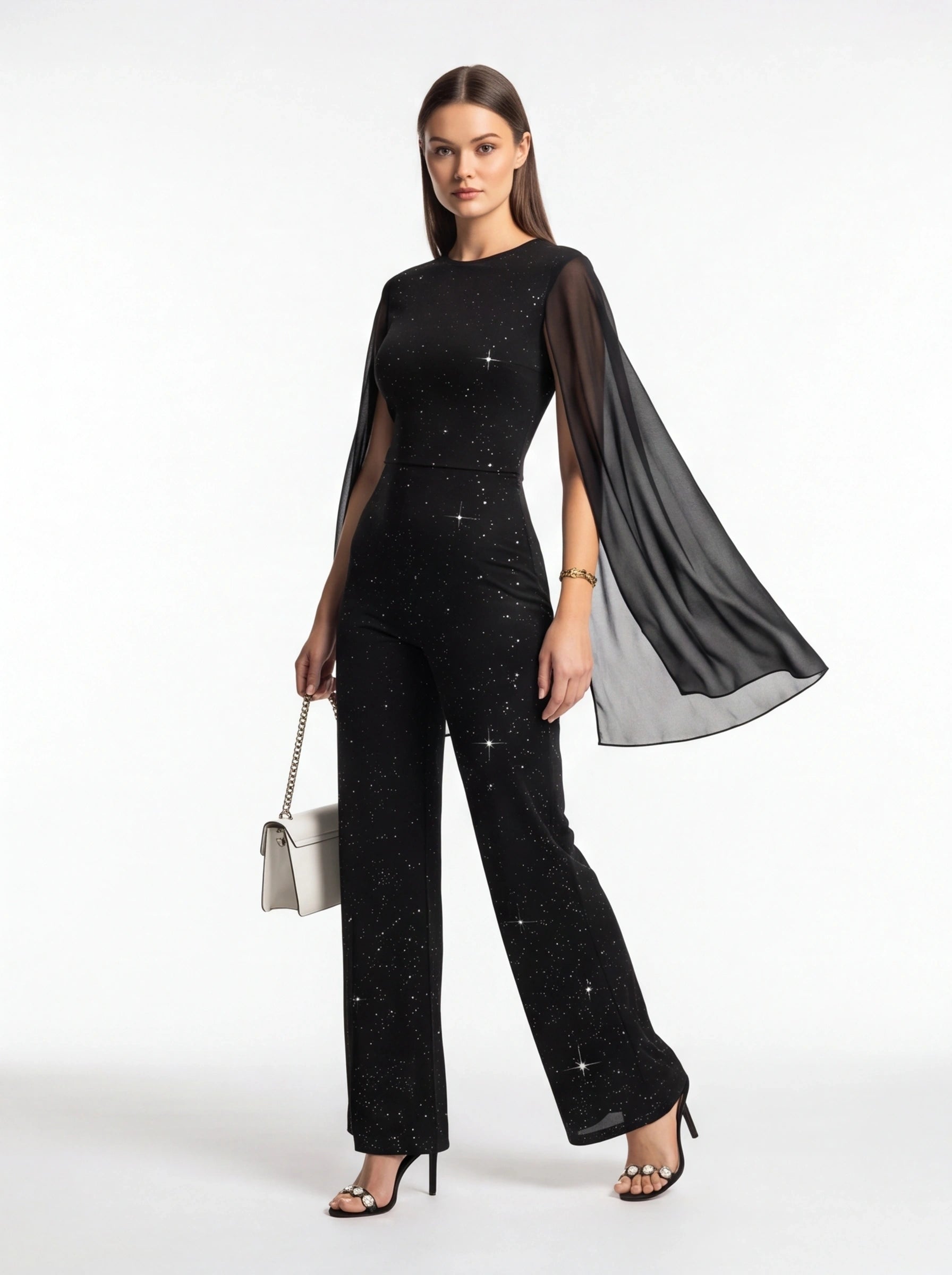 Jamota black jumpsuit with glitter speckled pattern and sheer cape sleeves, wide-leg pants