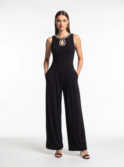 Jamota black jumpsuit with pleated wide-leg silhouette, rhinestone neckline with keyhole cutout and pockets