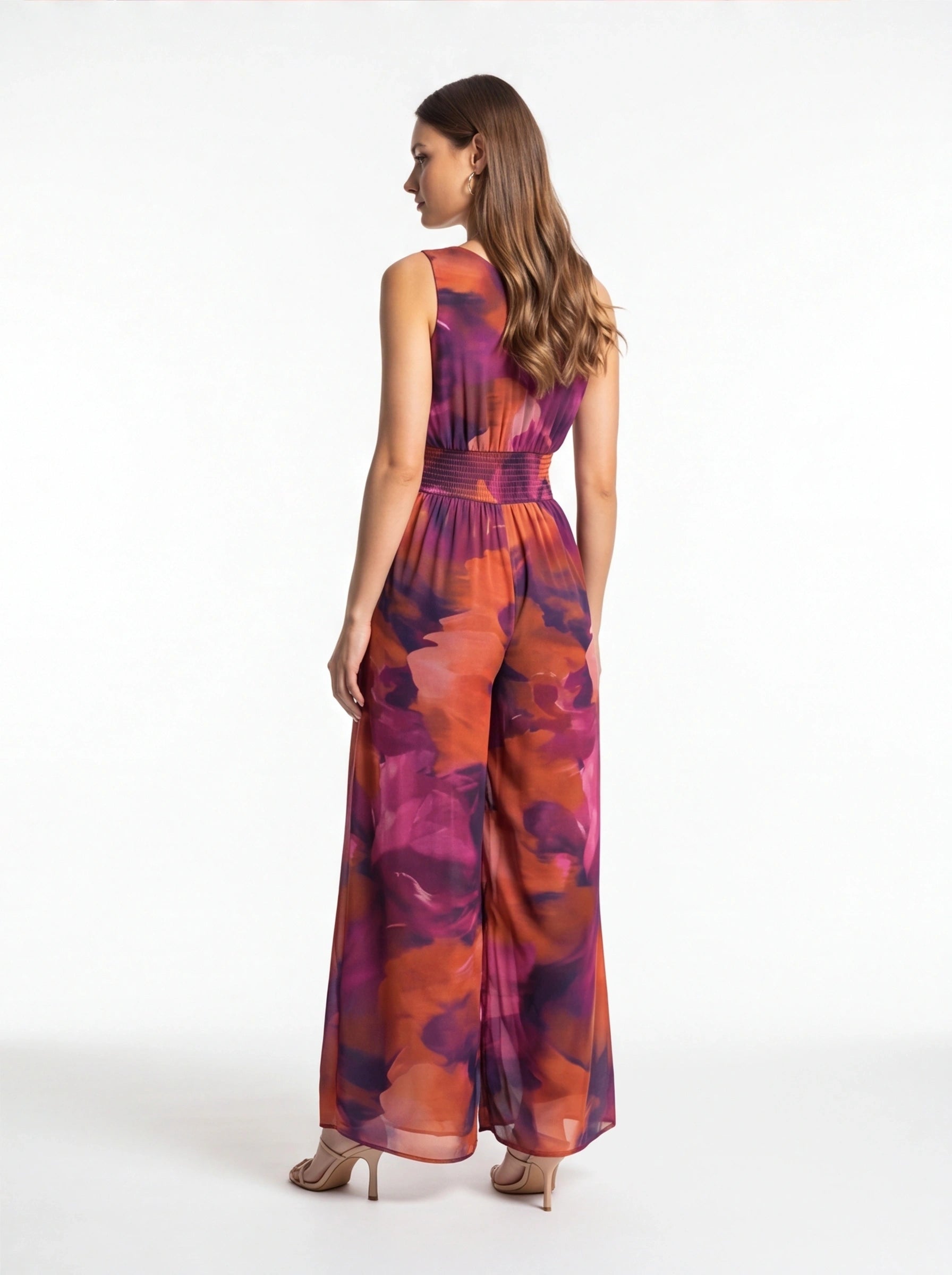 Jamota multicolor tie-dye women's jumpsuit with sleeveless top, elastic waist, and wide-leg pants.
