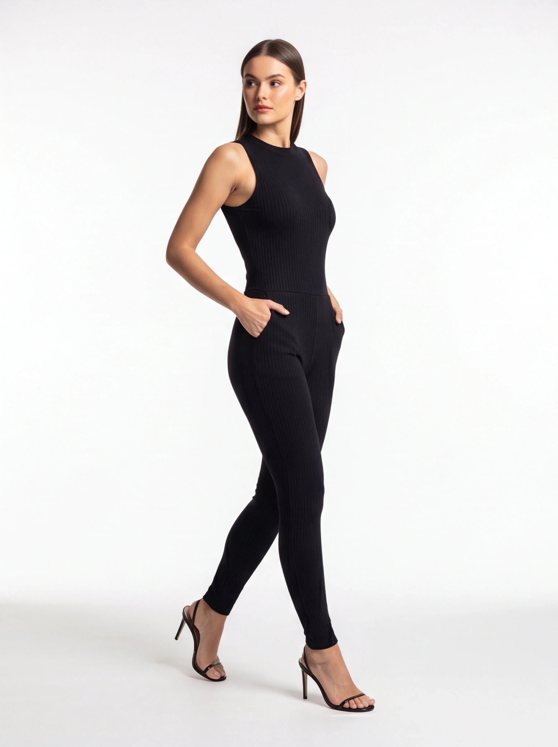 Jamota black ribbed jumpsuit with pockets and tailored fit, sleeveless high-neck design and full-length legs