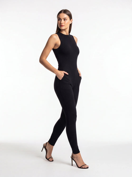 Jamota black ribbed jumpsuit with pockets and tailored fit, sleeveless high-neck design and full-length legs