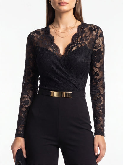 Jamota black lace jumpsuit with long lace sleeves, V-neckline, and gold belt.