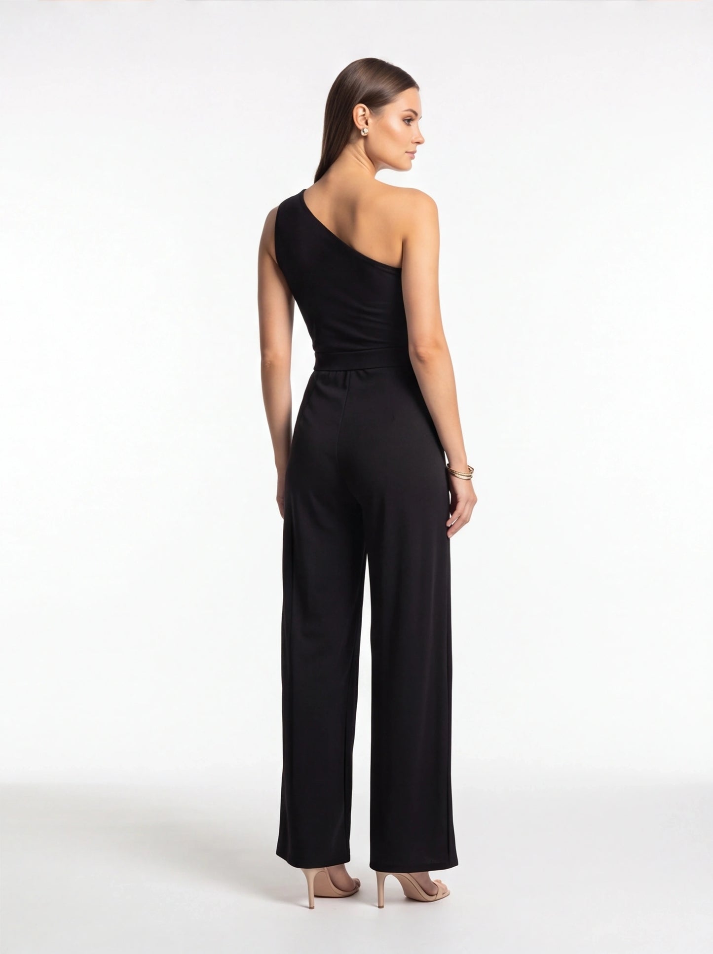 Jamota black one-shoulder women's jumpsuit with a high waist and wide-leg silhouette.