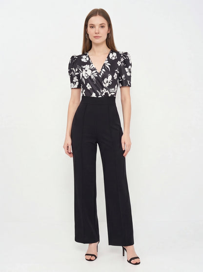 Jamota black floral print jumpsuit with belted waist and wide-leg pants
