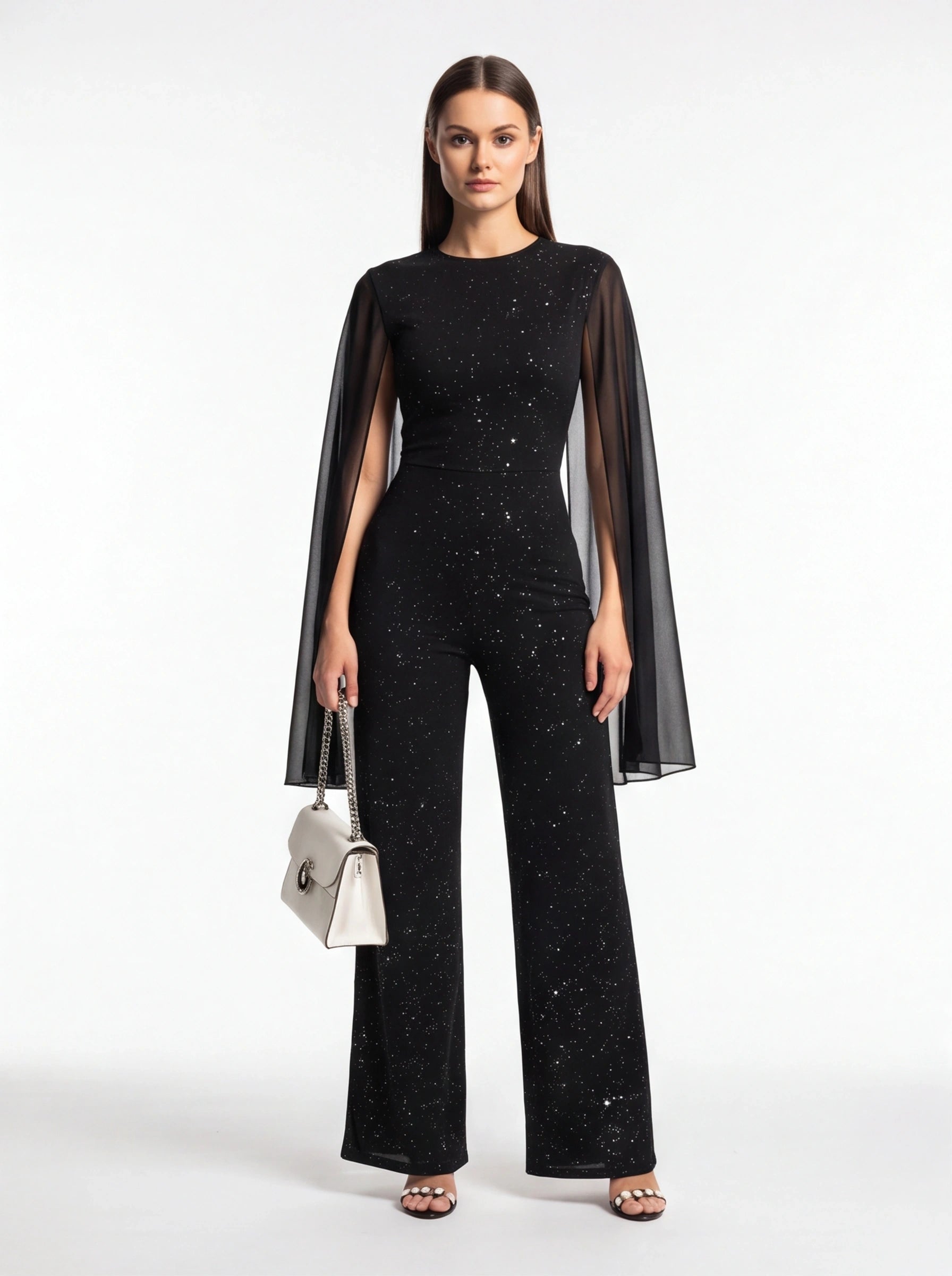 Jamota black jumpsuit with glitter speckle pattern and sheer cape sleeves, wide-leg pants