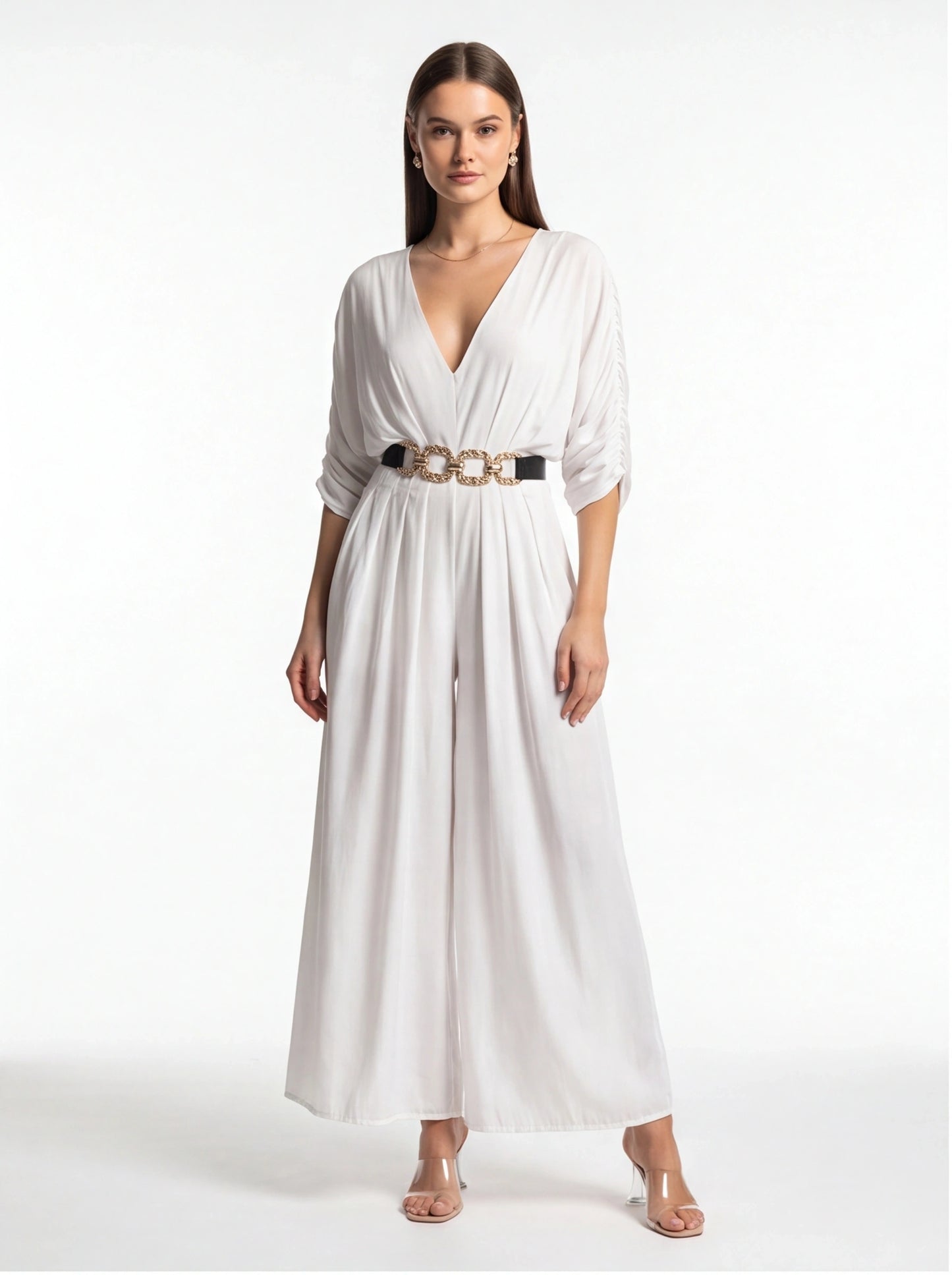 Jamota white jumpsuit with V-neck, draped sleeves, wide legs and gold chain belt