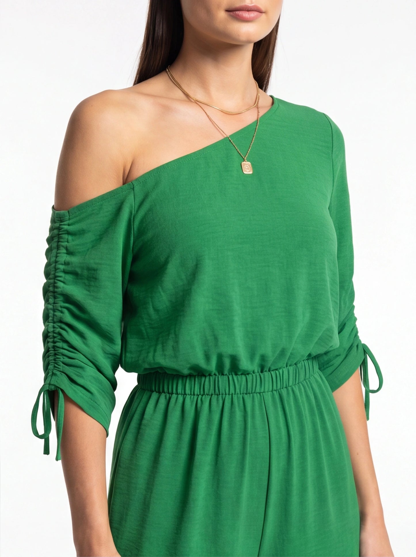 Jamota green jumpsuit with off-shoulder neckline, ruched long sleeves, and elastic waist with tie.