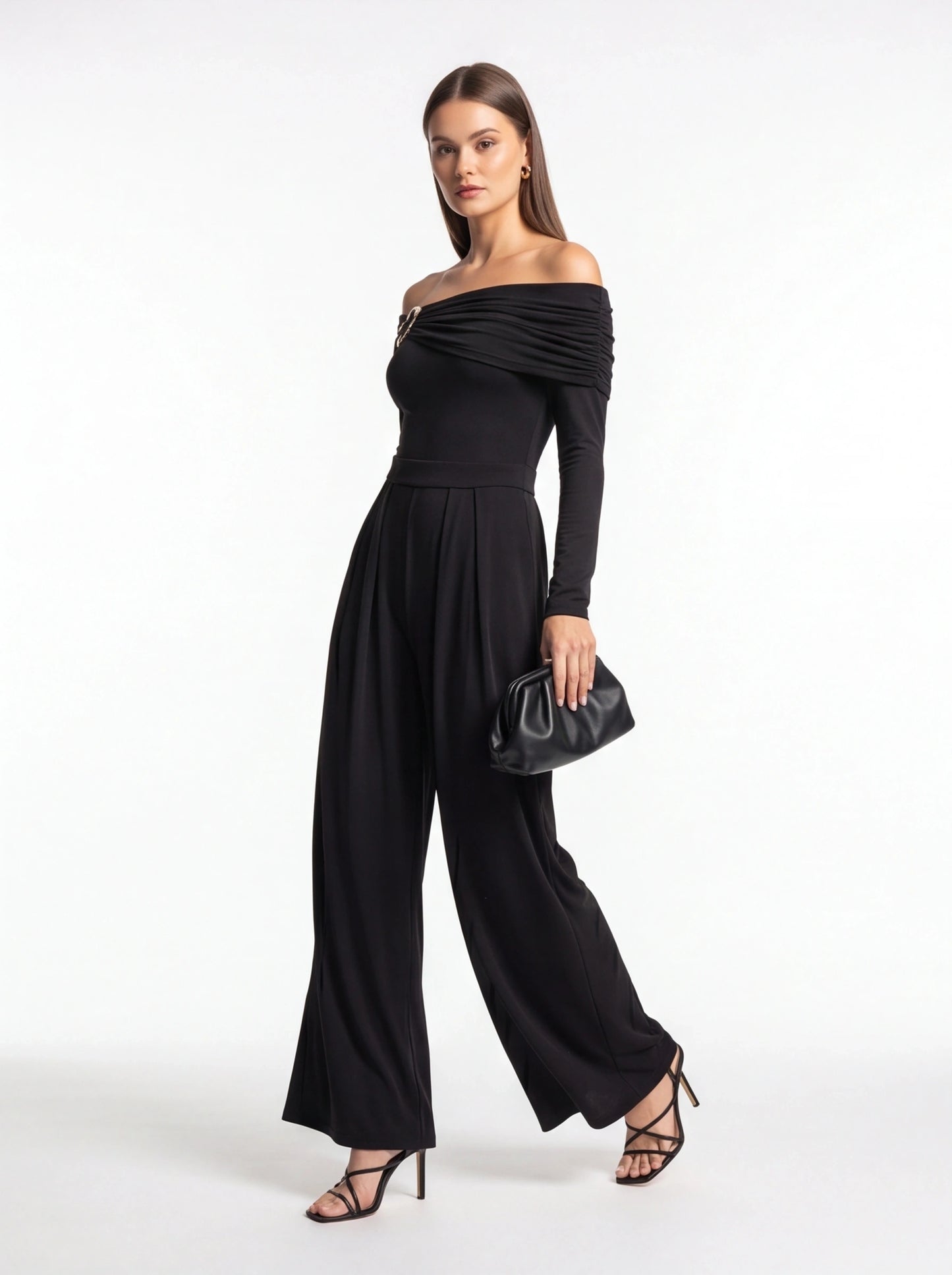 Jamota black jumpsuit with off-shoulder draped neckline, long sleeves, belt at waist and wide-leg pants