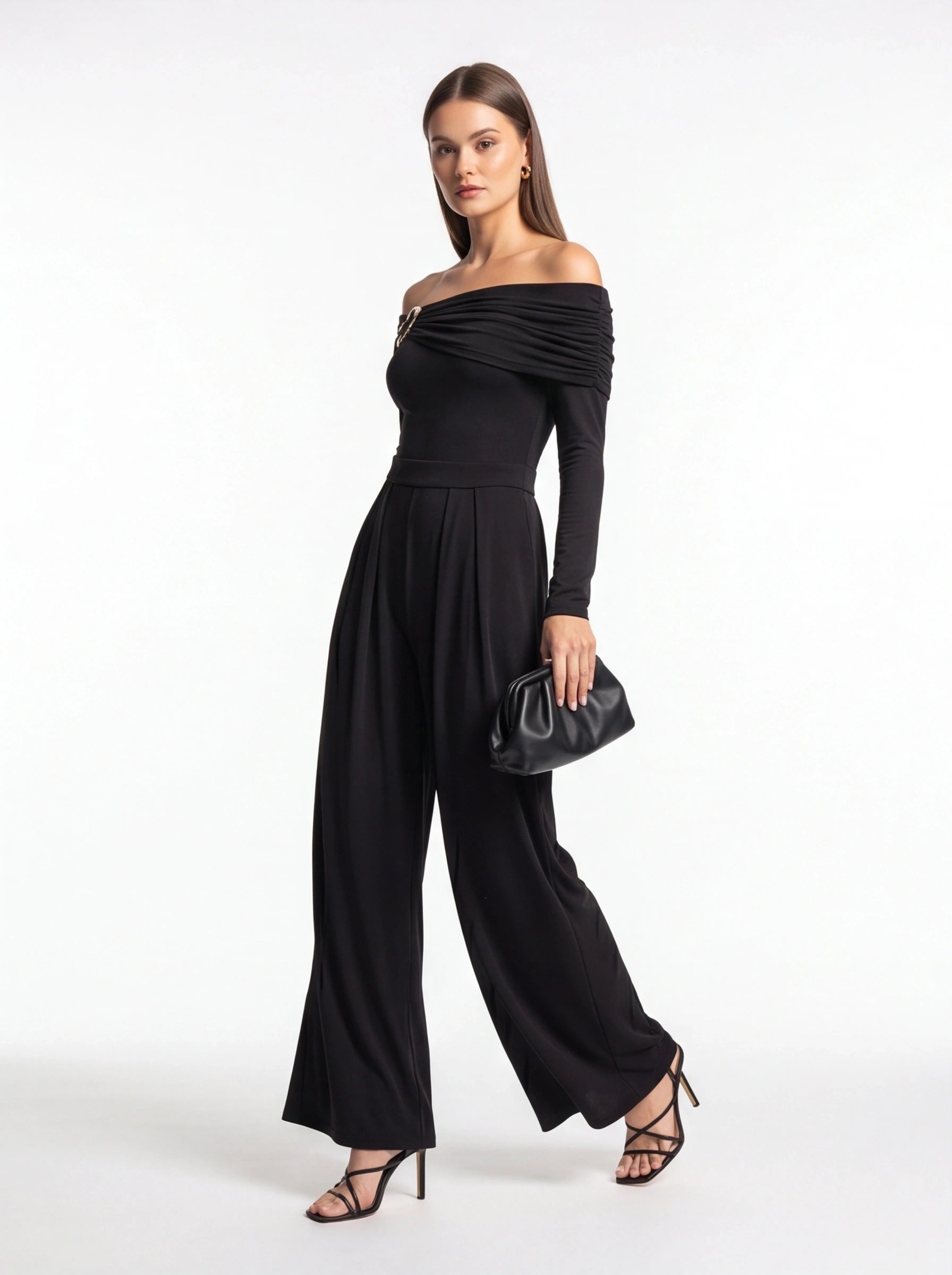 Jamota black jumpsuit with off-shoulder draped neckline, long sleeves, belt at waist and wide-leg pants